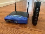 Linksys WRT54G 2.4GHZ Wireless-g Router W/ 4-PORT & Motorola SB5120 Cable Modem. Fixed Price $10.99.